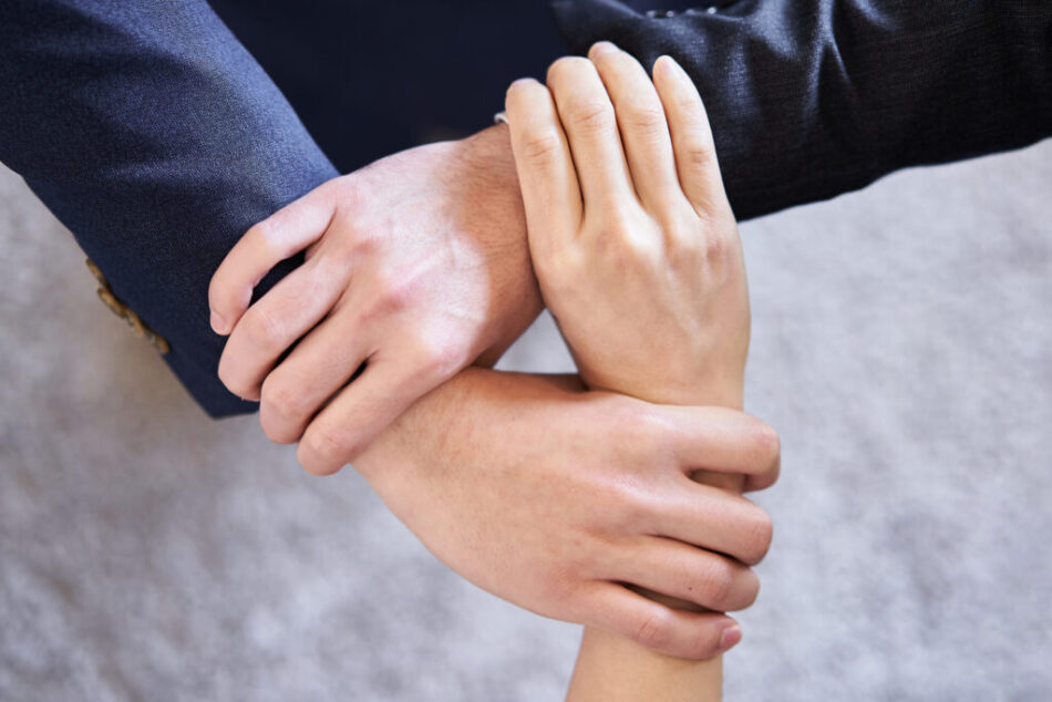 At hand of a united Asian business person At hand of a united Asian business person